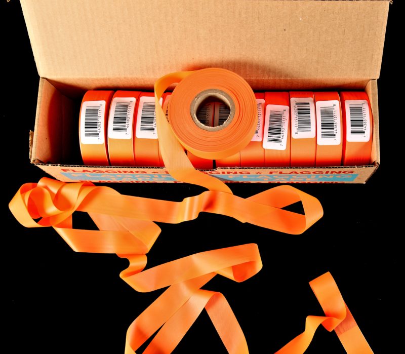 Orange flagging tape in box