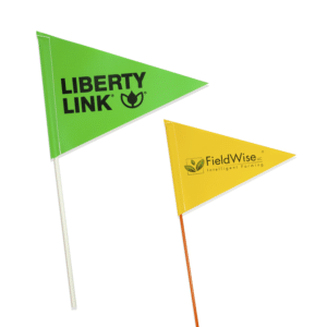 Custom printed flags are used for advertising in fields.
