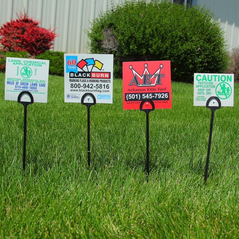Row of BMC custom yard marketing signs with step stakes